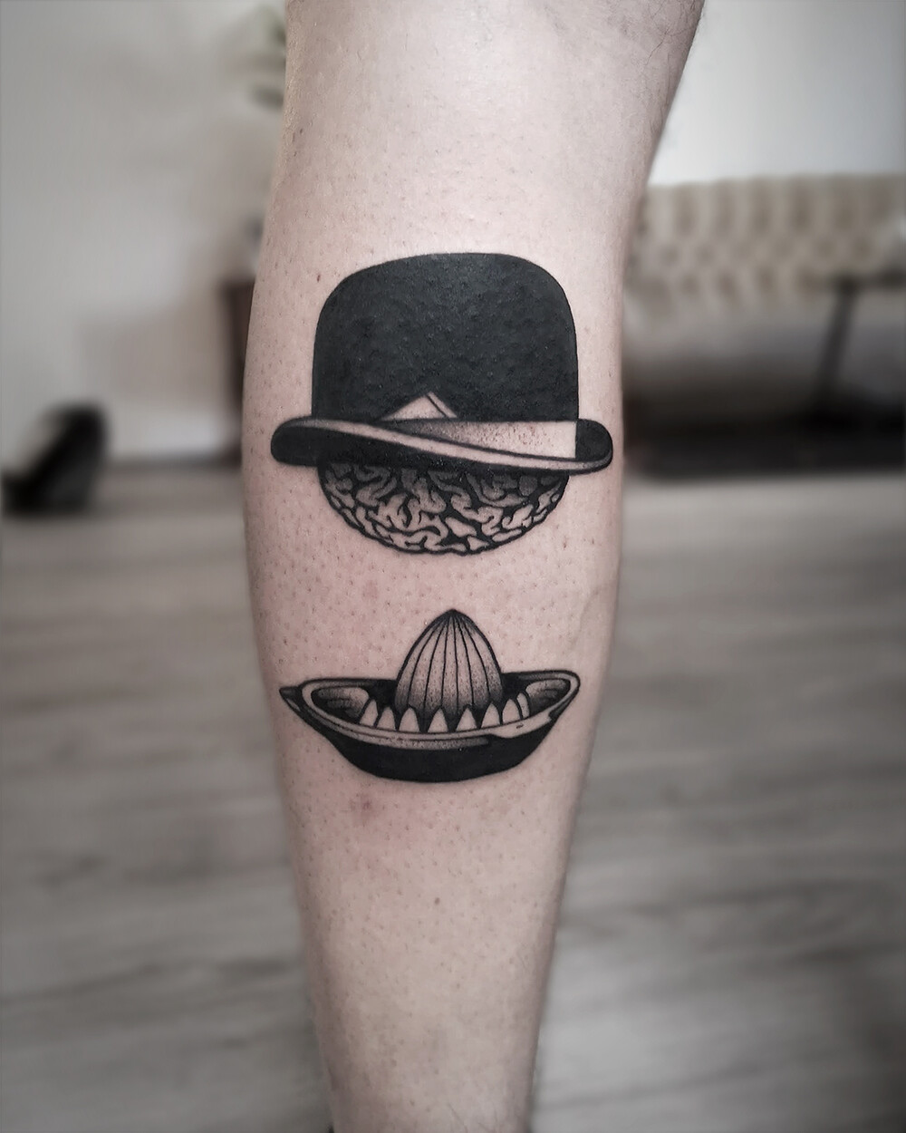 Blackwork Clockwork Orange Tattoo of Brain with melon hat by Christian Eisenhofer – Tattoo Berlin